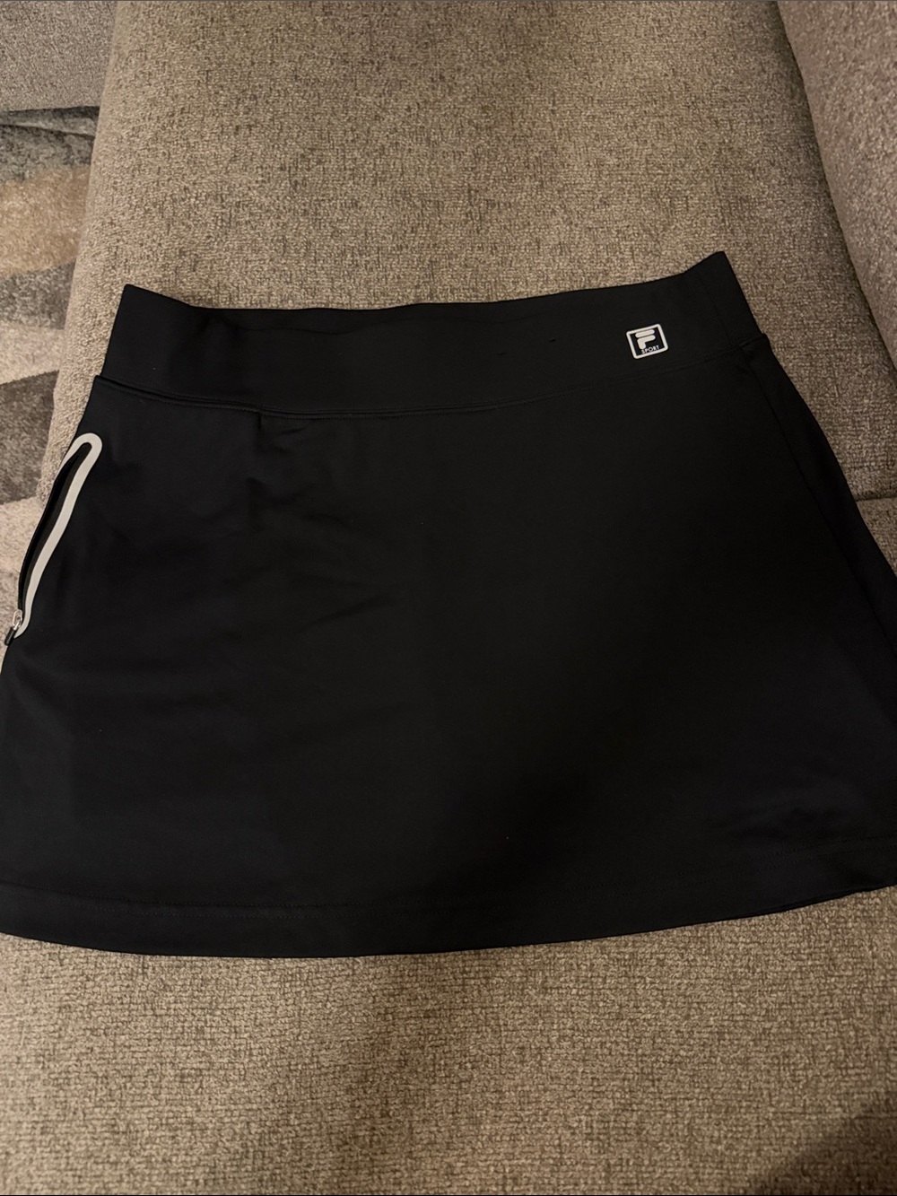 NWOT. Never Worn. FILA Black Sport Skort with Reflective Pocket Accent